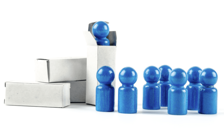 A group of blue people sitting in front of boxes.